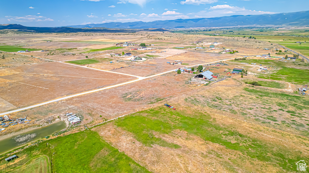 Birds eye view of property featuring a mountain view and a rural view