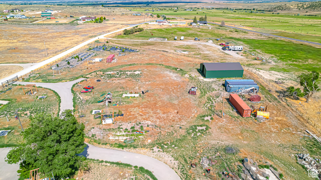 Birds eye view of property featuring a rural view