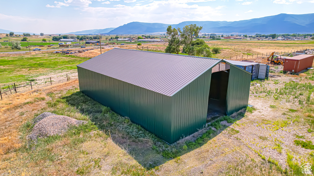 View of outbuilding with a mountain view and a rural view