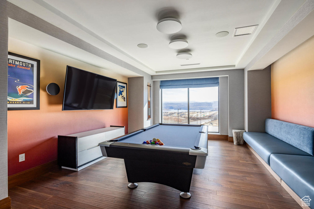 Rec room with dark wood-style floors, pool table, visible vents, and baseboards