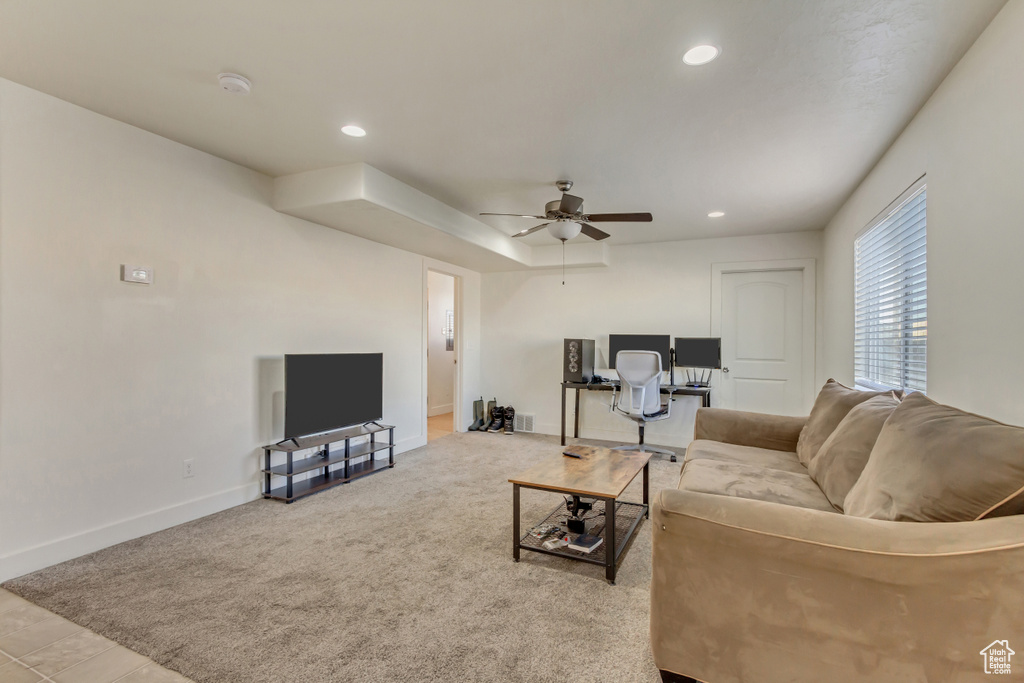 Living area with ceiling fan, recessed lighting, light carpet, and baseboards