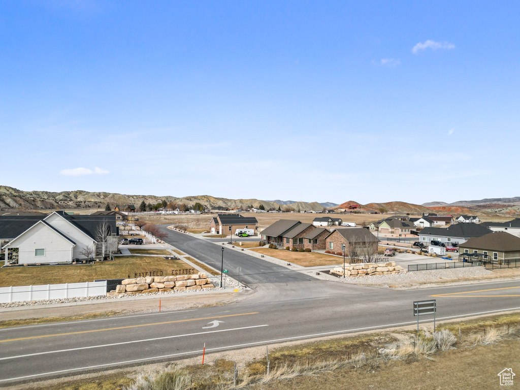 Exterior space featuring a residential view and a mountain view