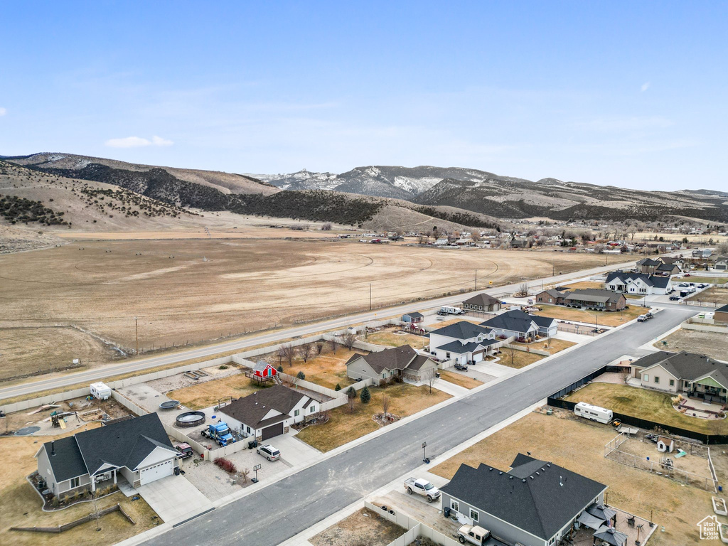 Drone / aerial view with a residential view and a mountain view