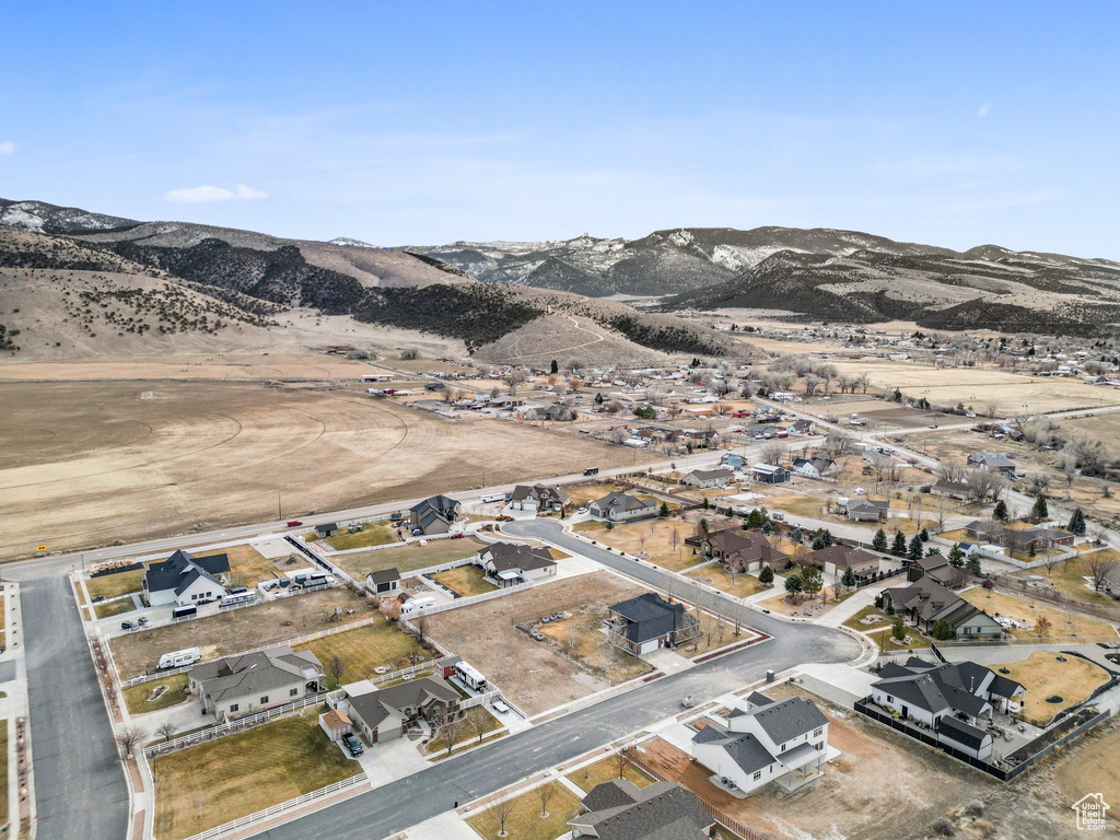 Drone / aerial view with a residential view and a mountain view