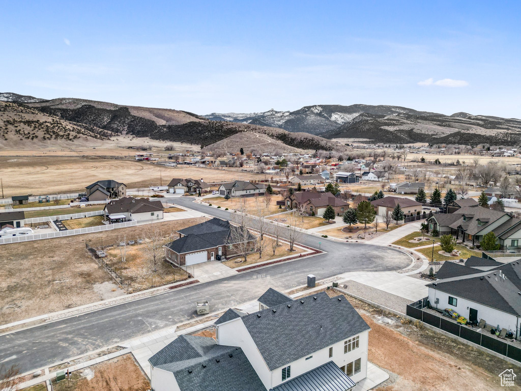 Birds eye view of property with a residential view and a mountain view