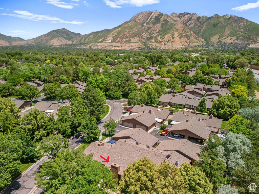 Aerial view of residential area featuring a mountainous background