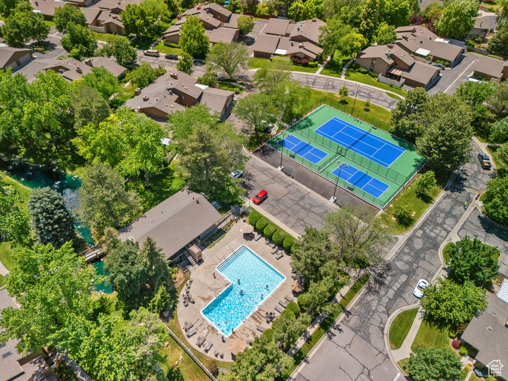 Aerial perspective of suburban area with a pool area