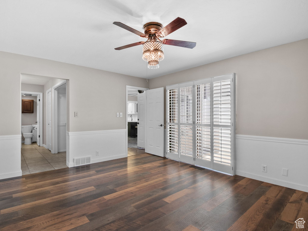 Spare room with a ceiling fan and wood finished floors
