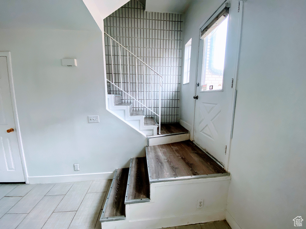Interior space featuring baseboards and stairs