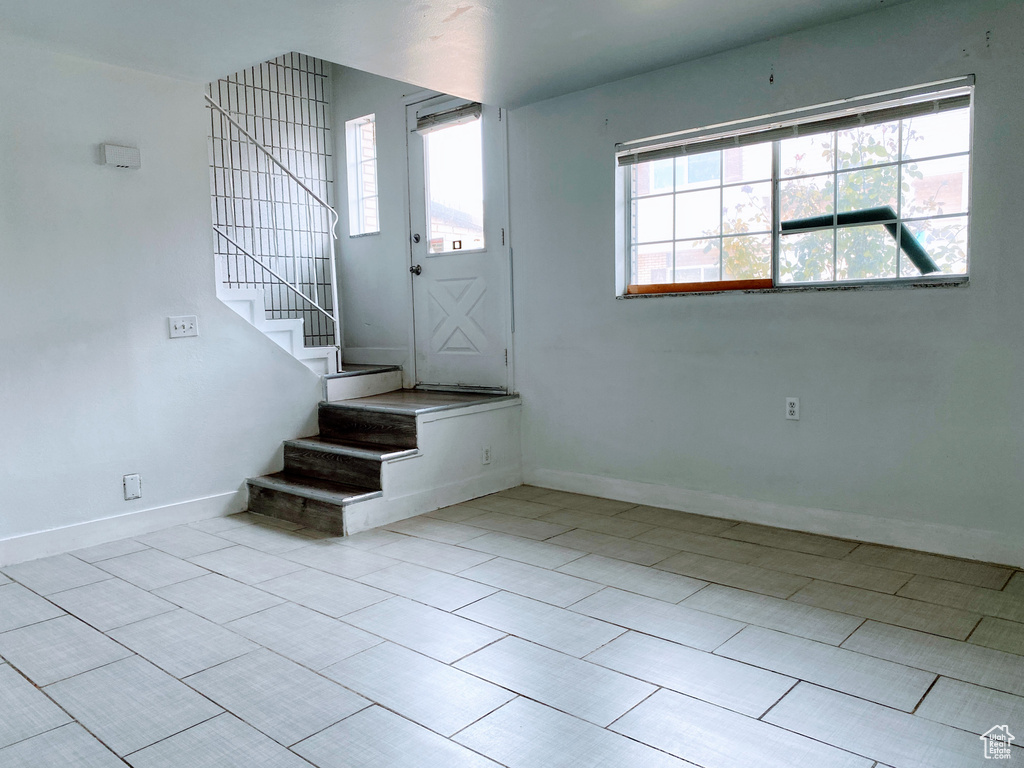 Entryway with baseboards and stairs