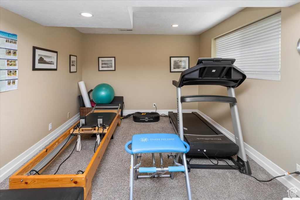 Workout room featuring baseboards, recessed lighting, and carpet flooring
