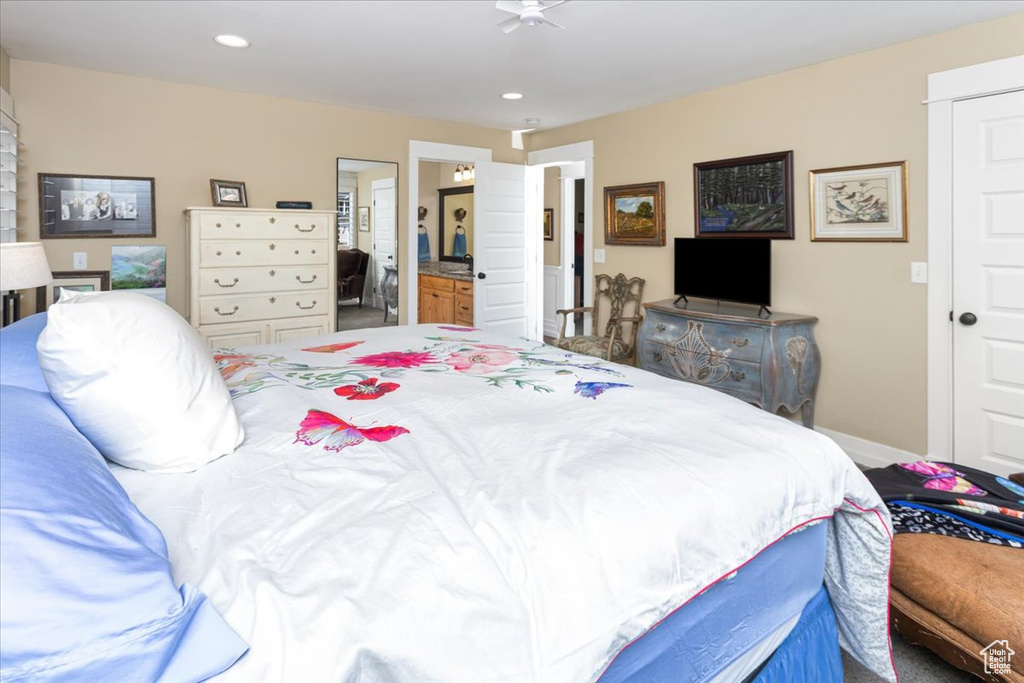 Bedroom featuring recessed lighting, ensuite bathroom, and baseboards