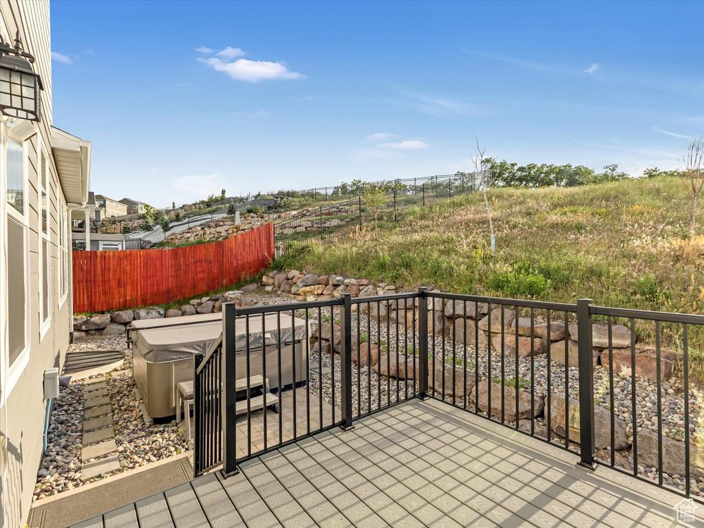 Patio / terrace featuring a hot tub
