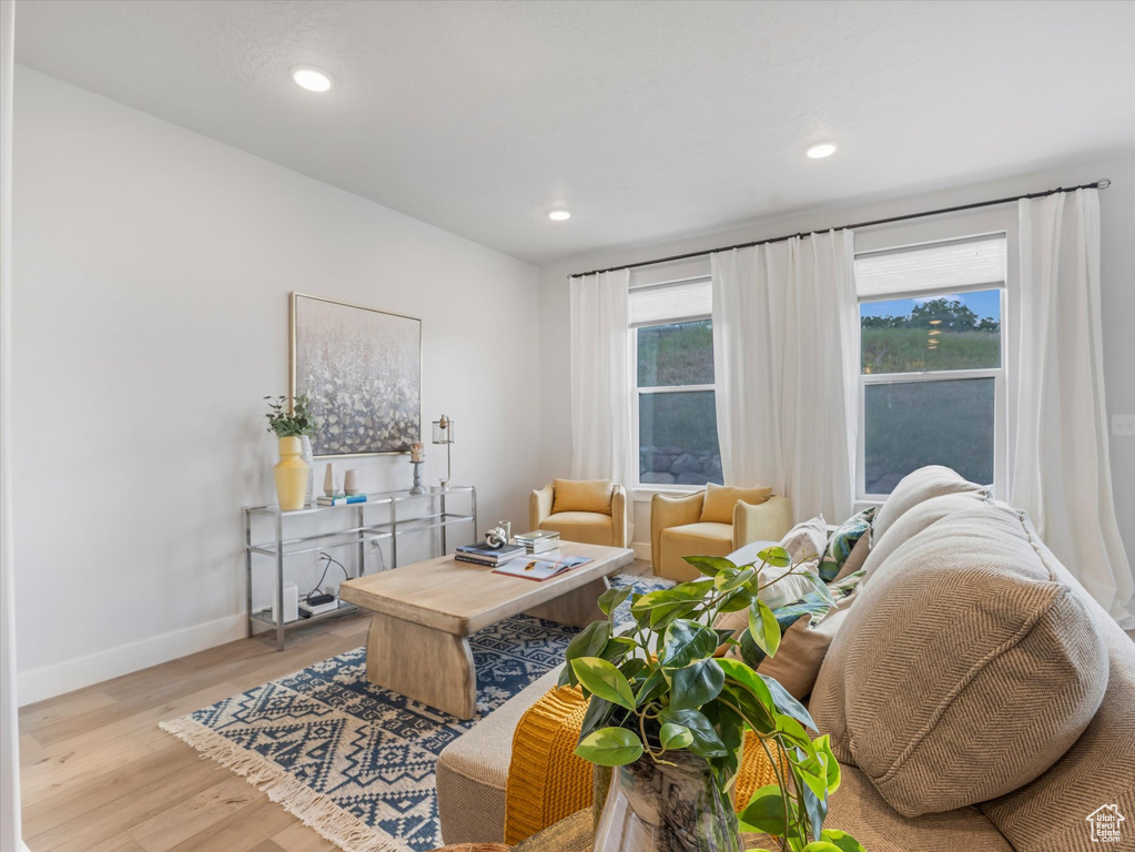 Living room featuring wood finished floors and recessed lighting