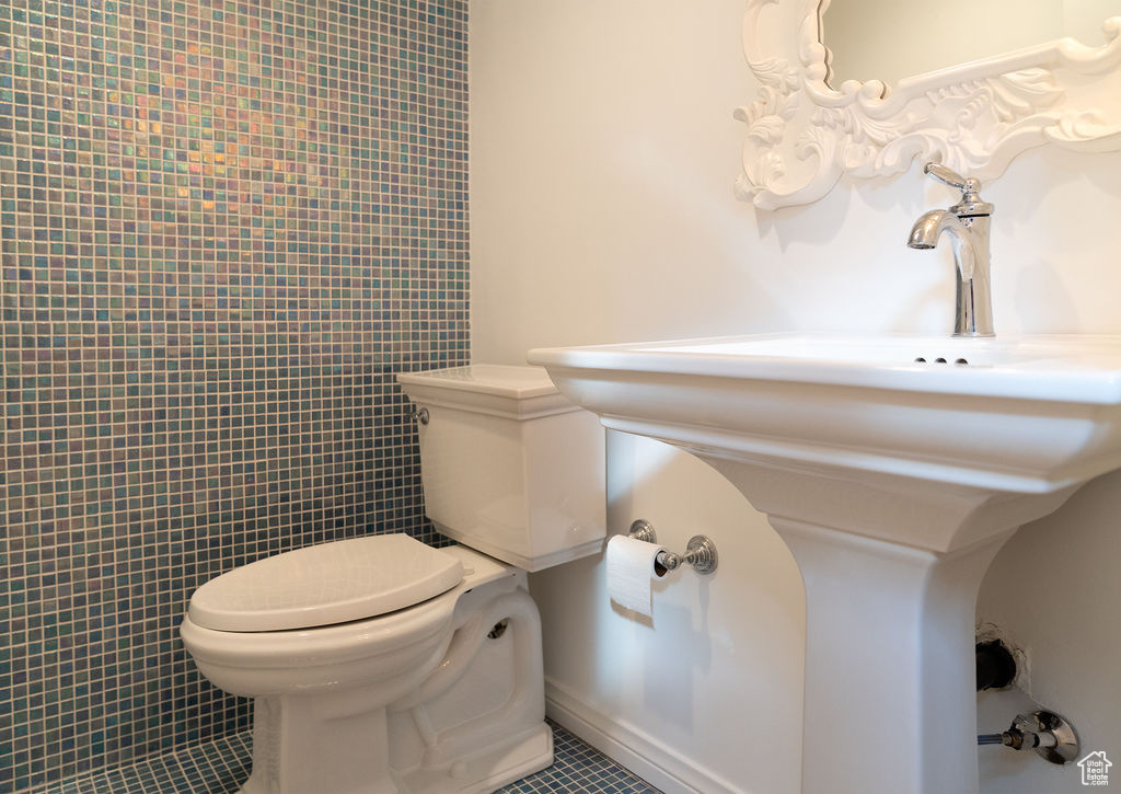 Bathroom with tile patterned floors and toilet