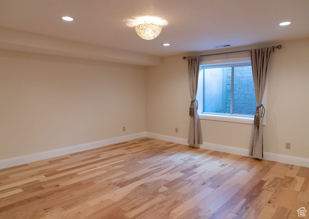 Spare room with light hardwood / wood-style flooring