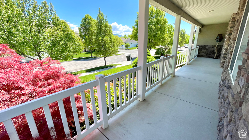 Balcony featuring covered porch