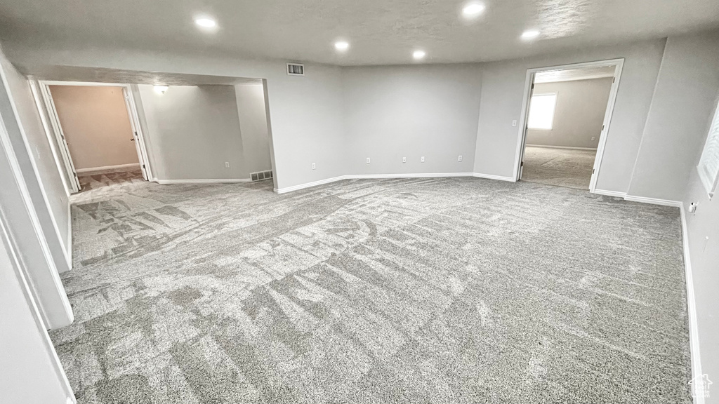 Below grade area with carpet flooring, recessed lighting, and baseboards