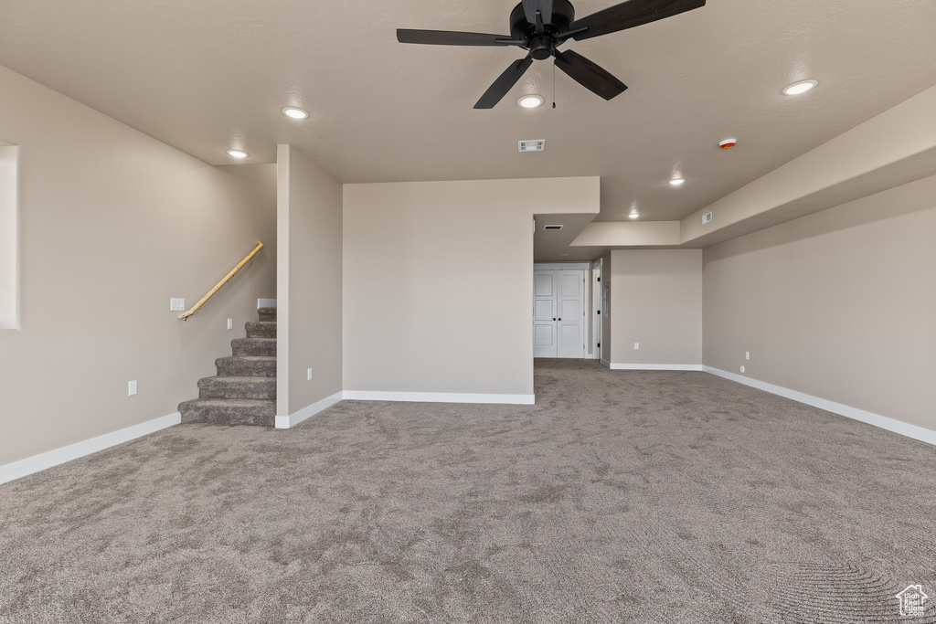 Unfurnished room featuring stairway, recessed lighting, visible vents, and baseboards