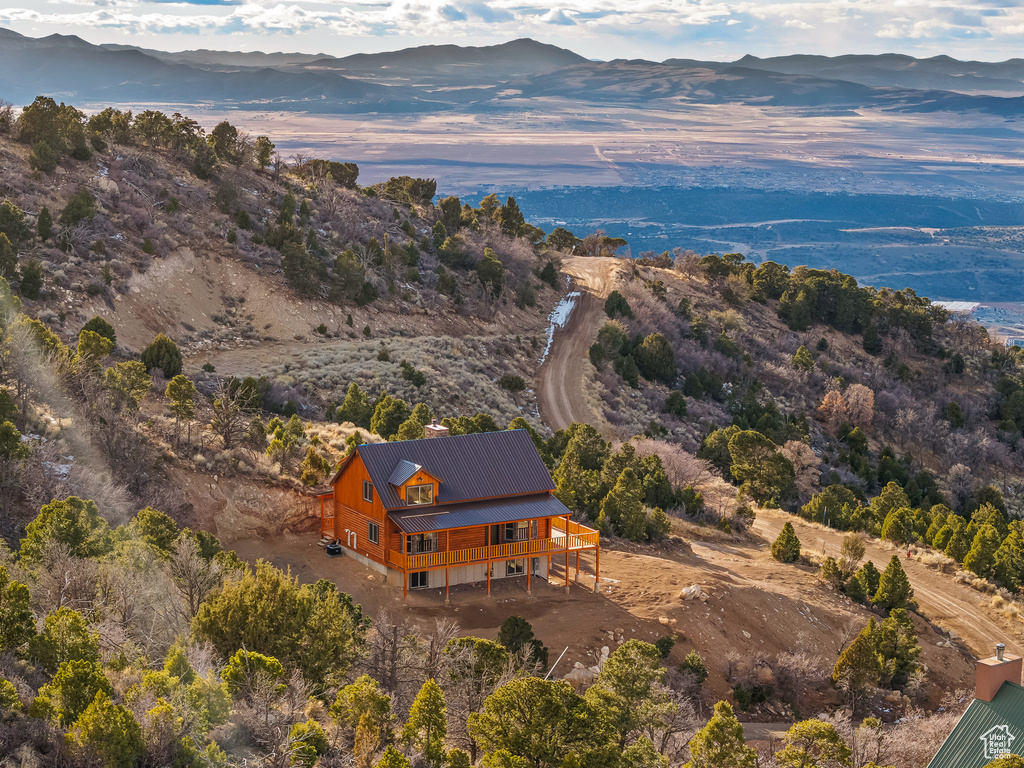 Birds eye view of property with a mountain view