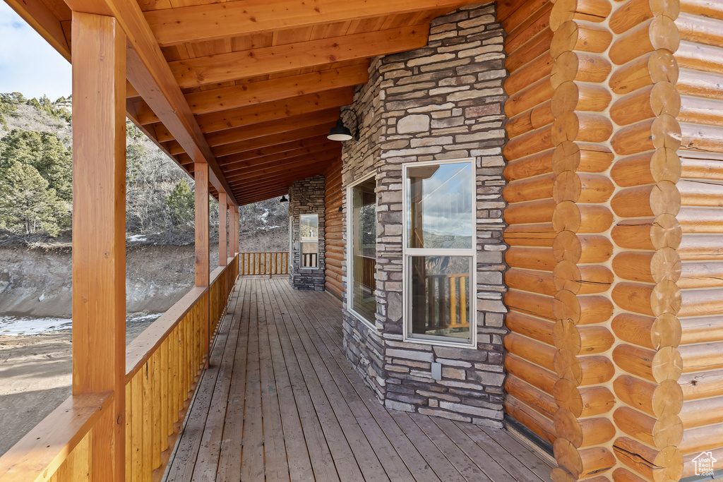 Wooden deck featuring covered porch