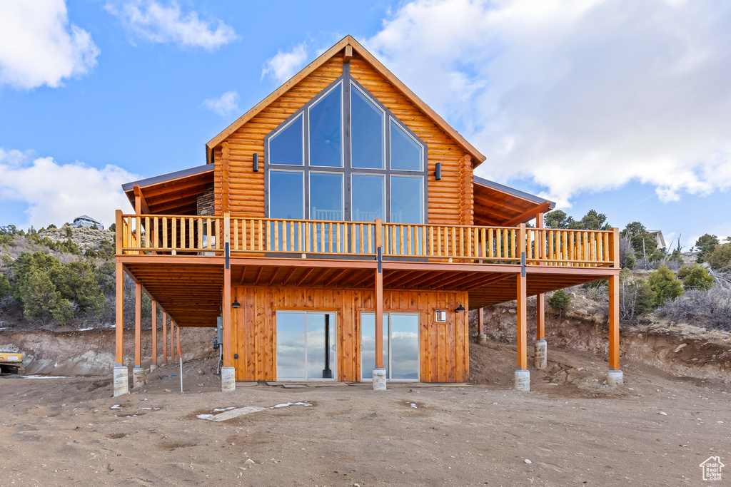 Rear view of property with a wooden deck