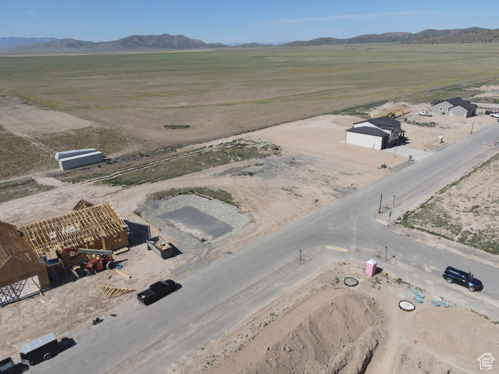 Aerial view of sparsely populated area featuring a mountain backdrop