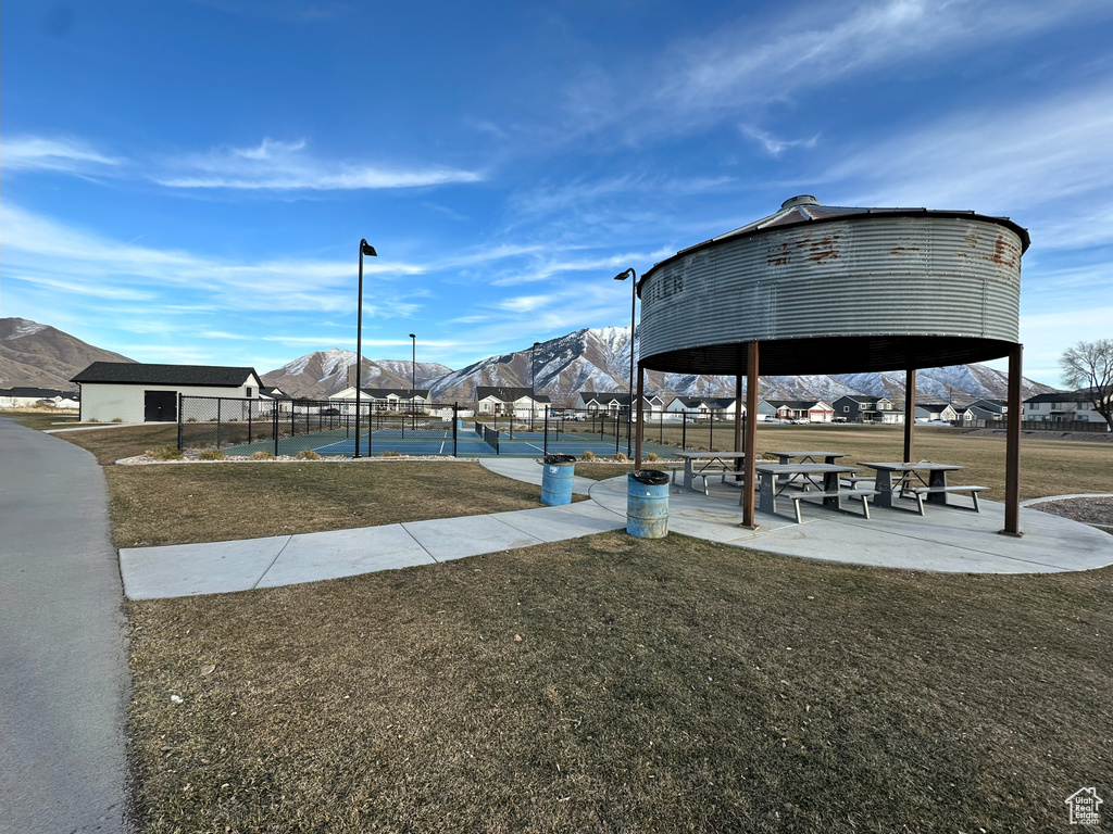 View of community with a gazebo, fence, and a yard