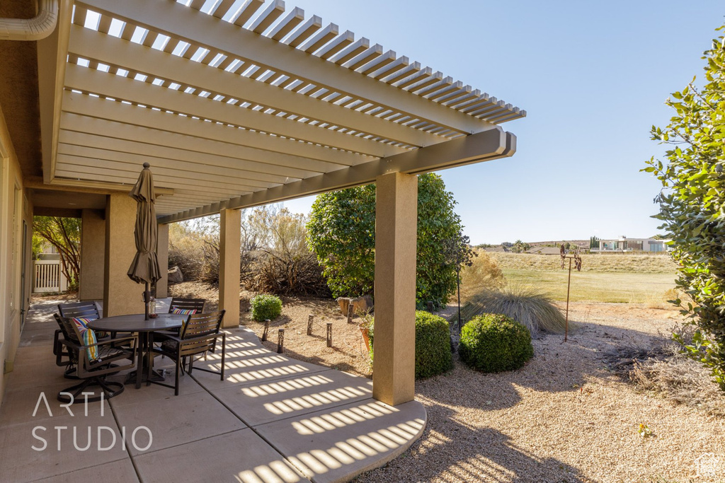 View of patio / terrace with outdoor dining area and a pergola