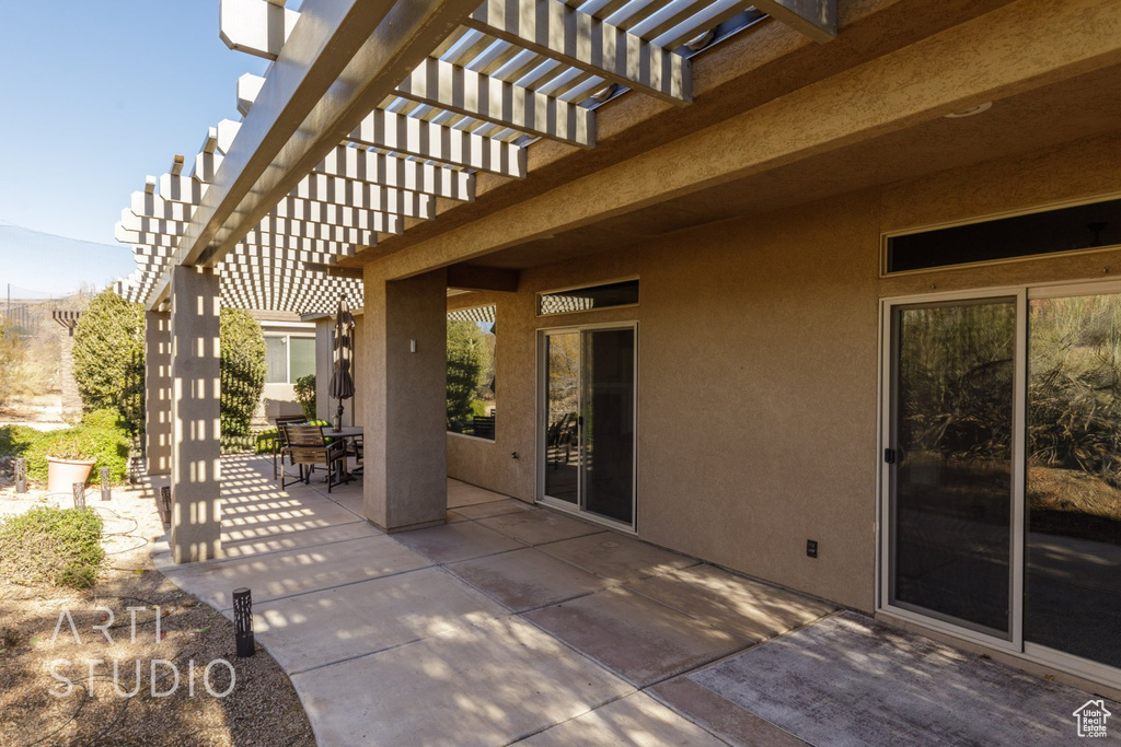 View of patio / terrace featuring a pergola and outdoor dining space