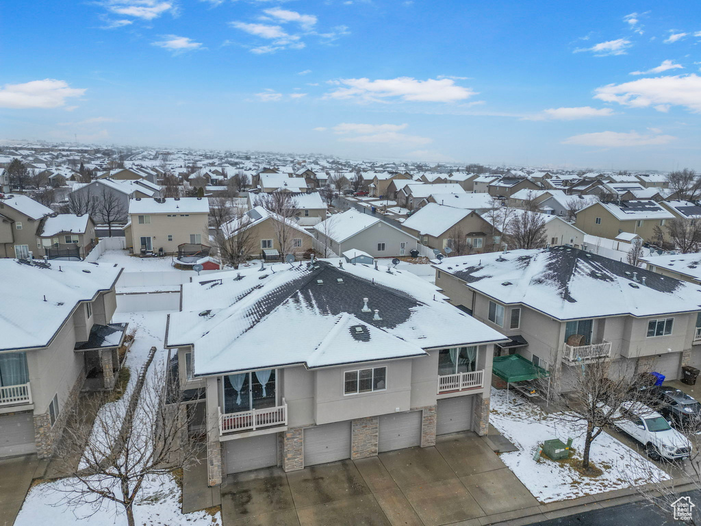 Snowy aerial view with a residential view