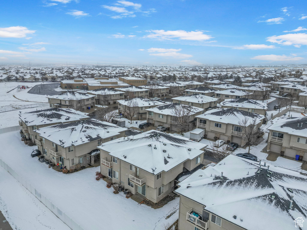 Snowy aerial view featuring a residential view