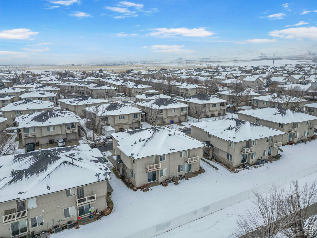 Snowy aerial view featuring a residential view