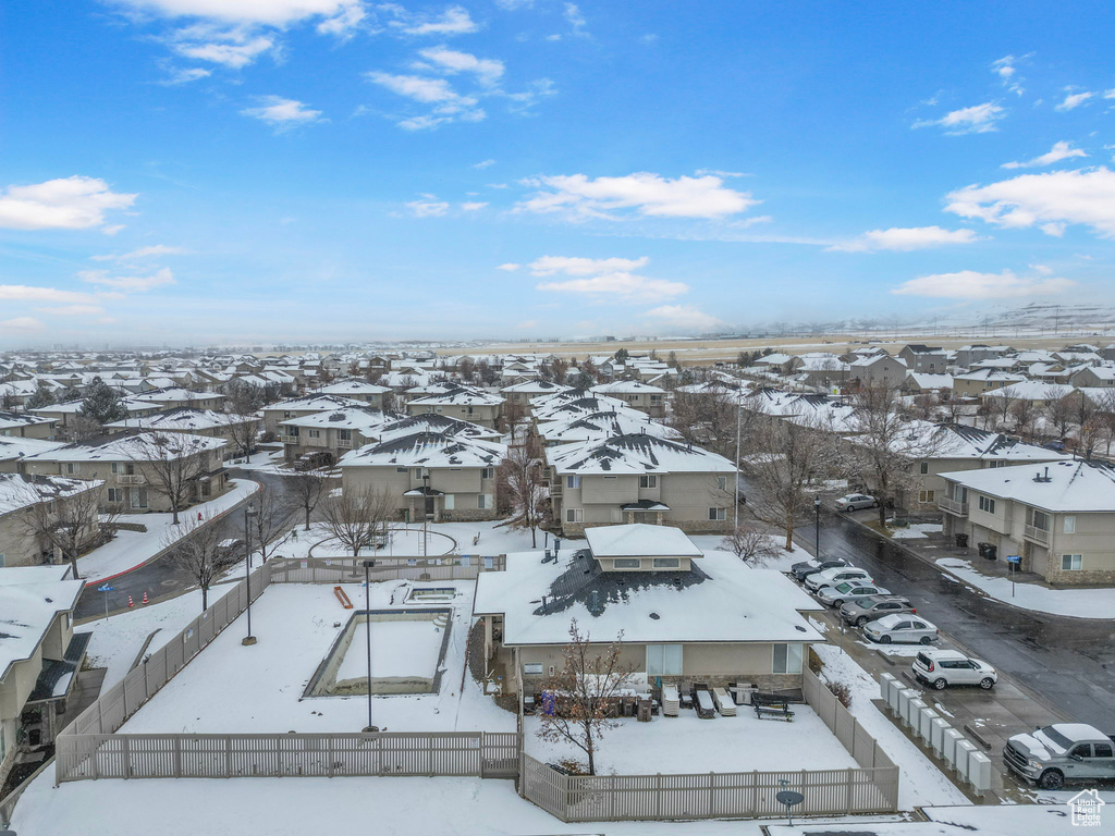 Snowy aerial view with a residential view