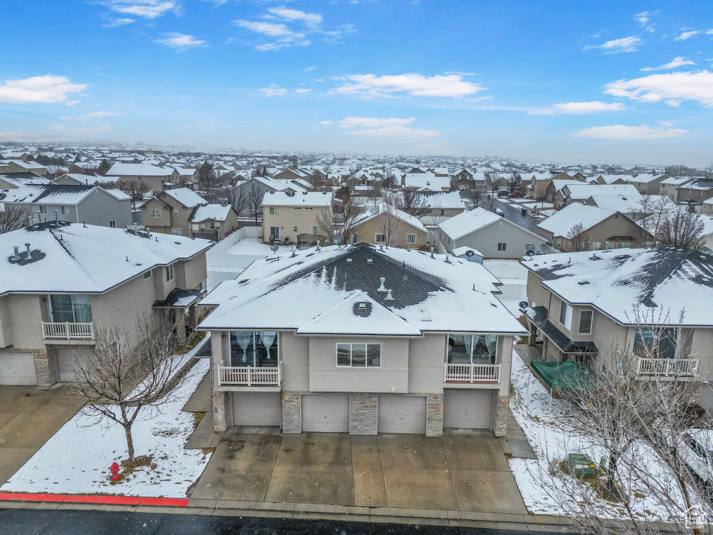 Snowy aerial view with a residential view