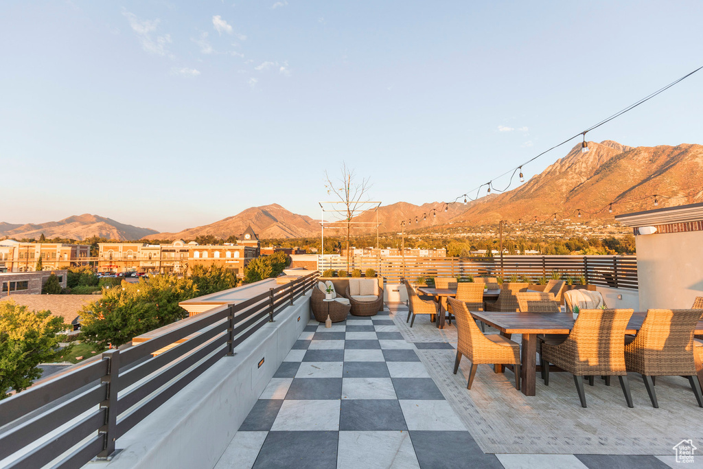 View of patio featuring outdoor dining area and a mountain view