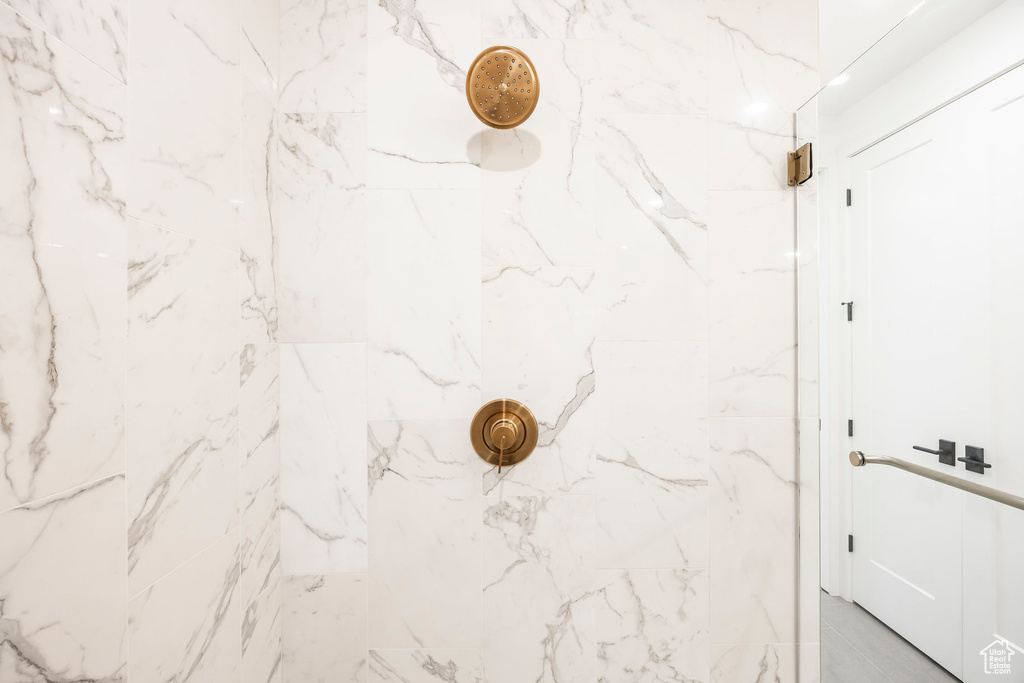 Interior details featuring a marble finish shower