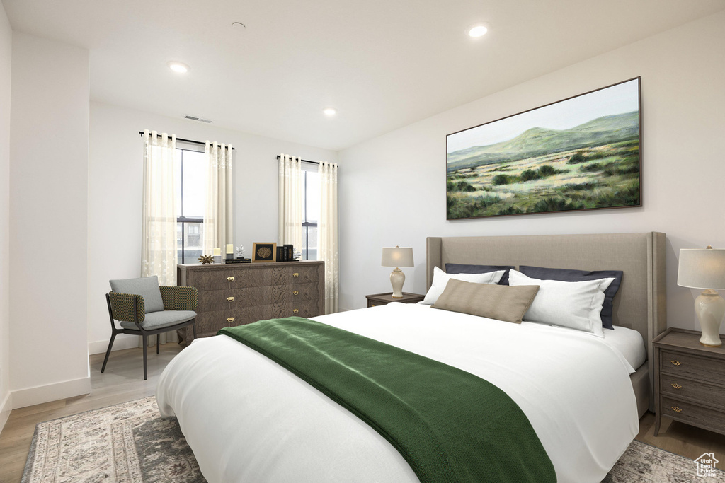 Bedroom featuring recessed lighting, visible vents, baseboards, and wood finished floors