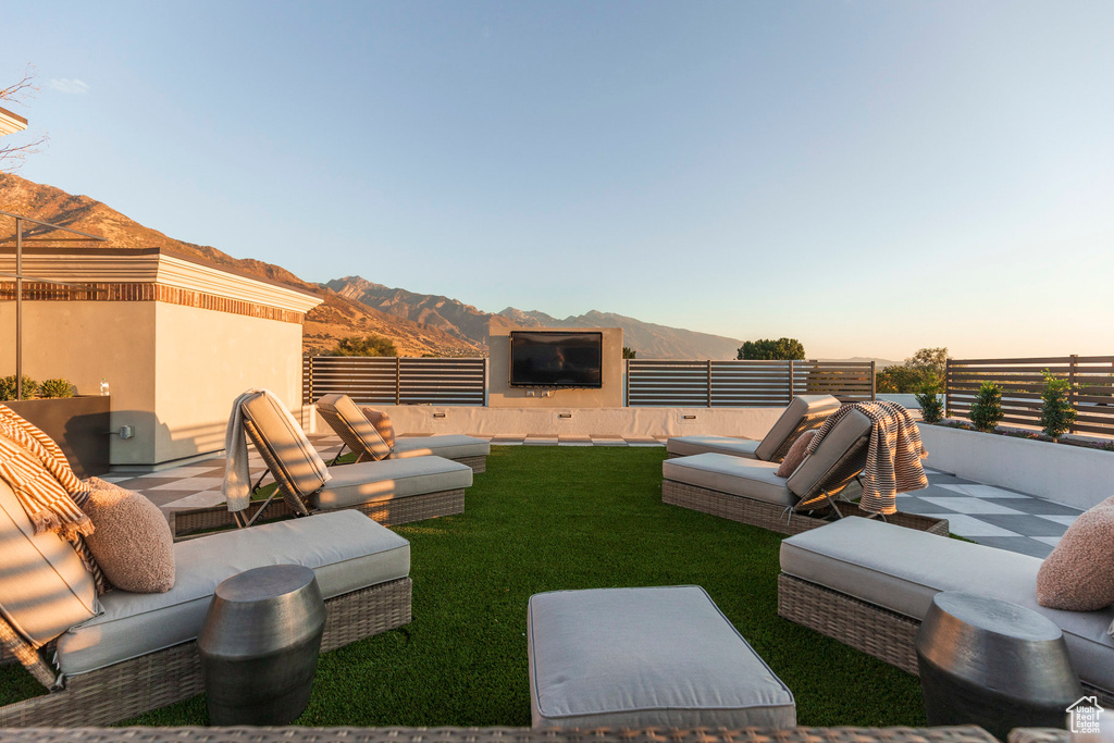 View of yard with fence, outdoor lounge area, and a patio