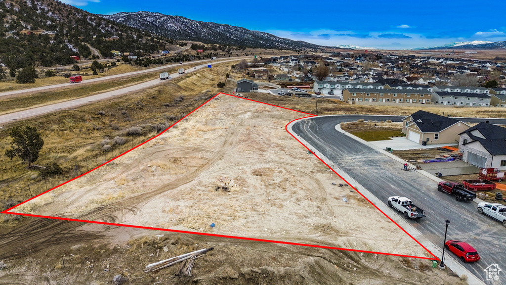 Drone / aerial view featuring a residential view and a mountain view