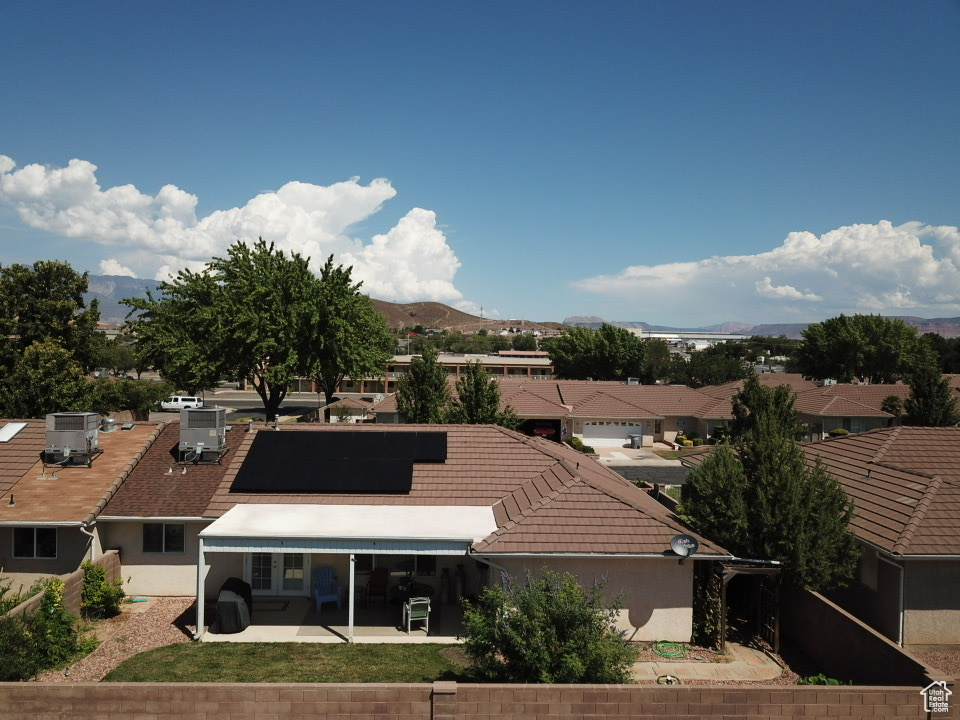 Drone / aerial view with a residential view and a mountain view