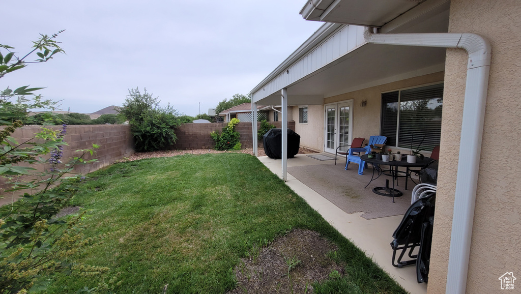 View of yard with a patio area and a fenced backyard