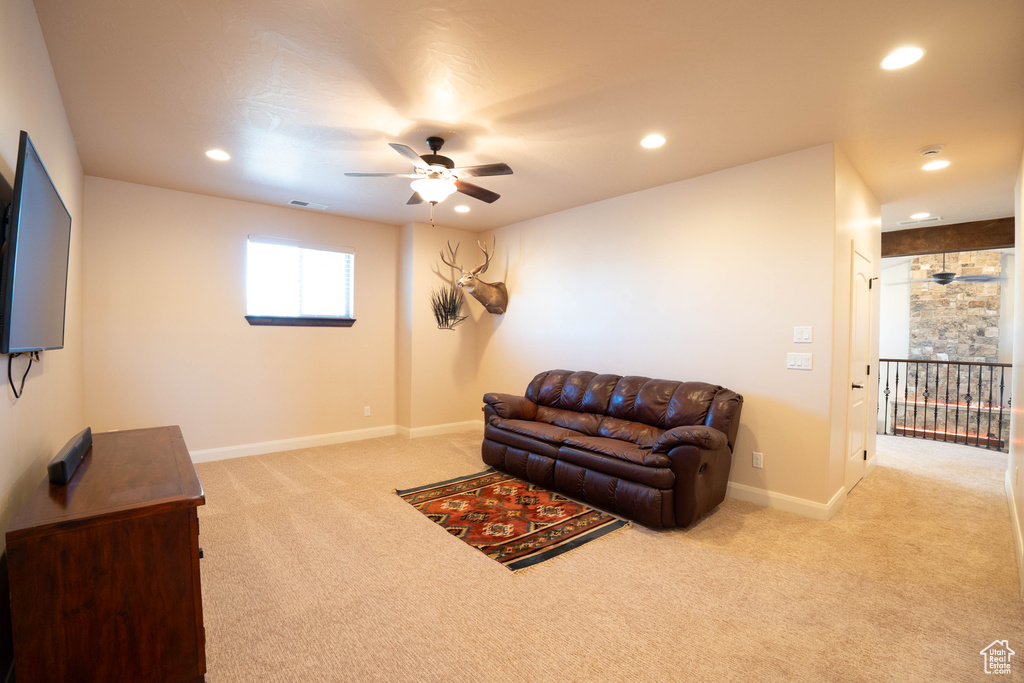 Living room featuring ceiling fan, recessed lighting, carpet floors, visible vents, and baseboards