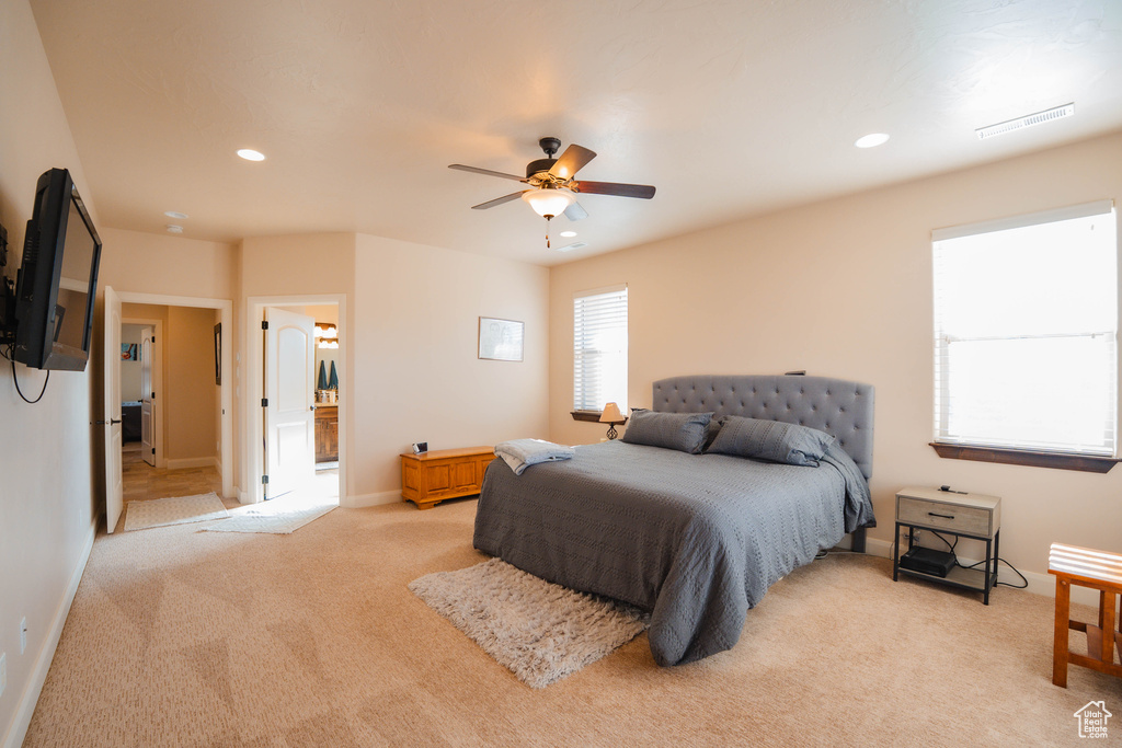 Bedroom with light carpet, baseboards, visible vents, and recessed lighting