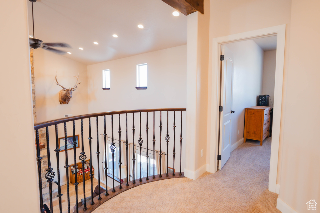 Corridor featuring light carpet, baseboards, and recessed lighting