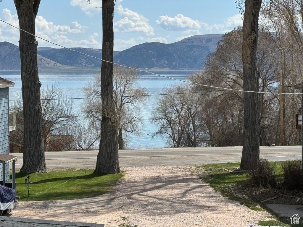 View of street featuring a water and mountain view