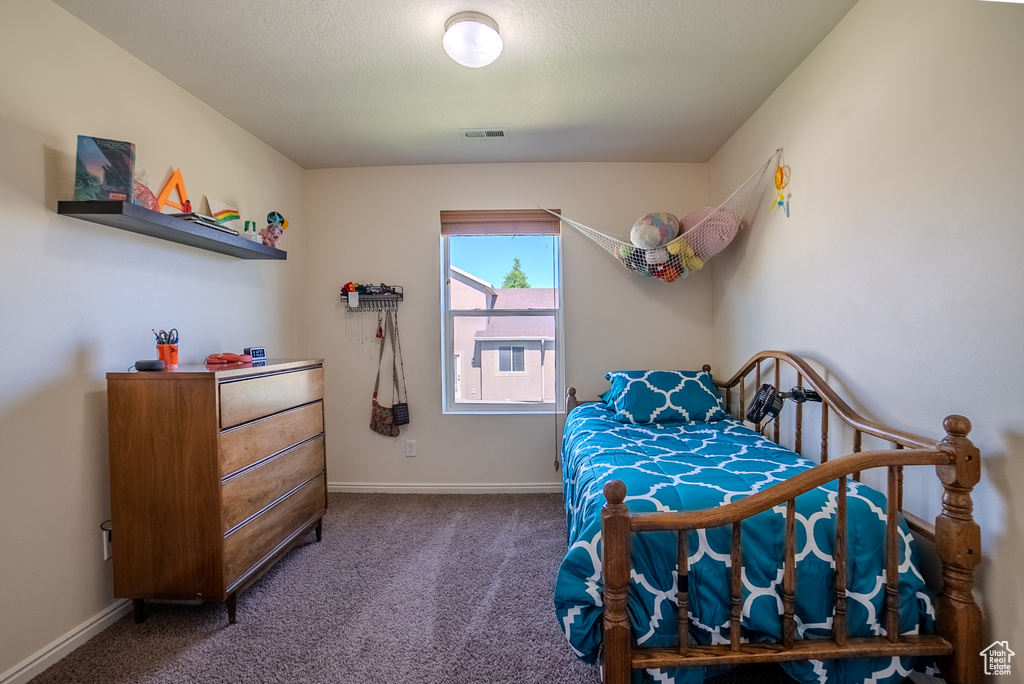 Bedroom with carpet and baseboards