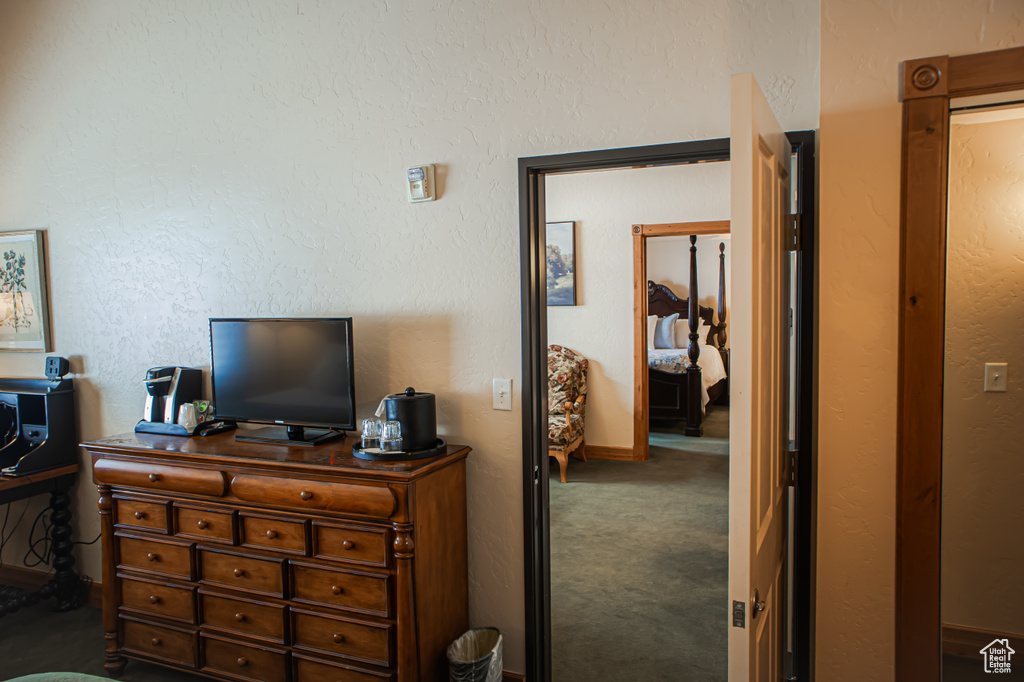 Bedroom with dark carpet