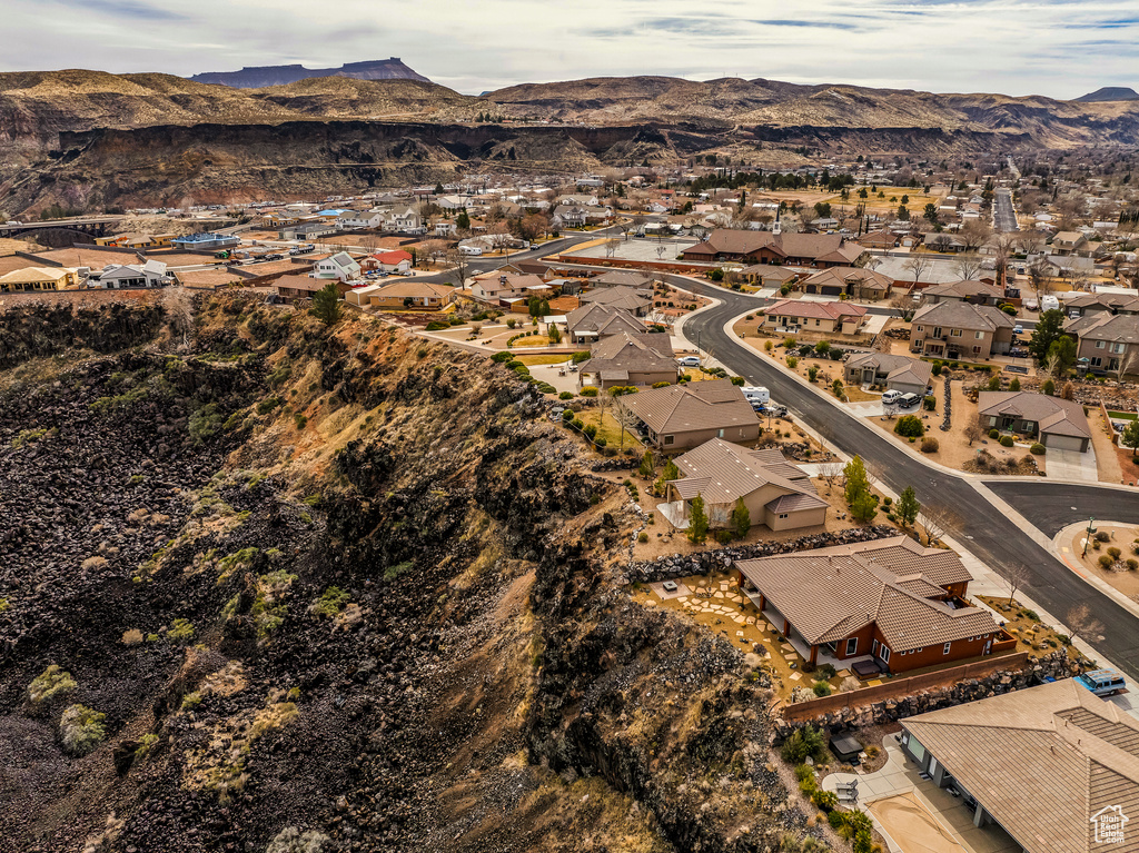 Birds eye view of property with a residential view and a mountain view