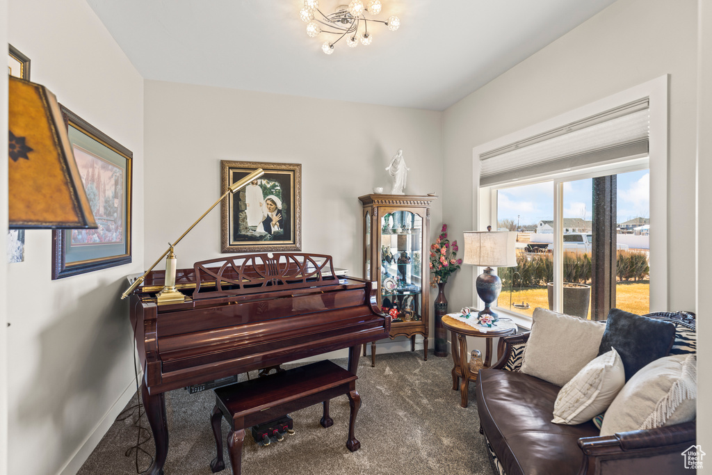 Sitting room with carpet floors and baseboards